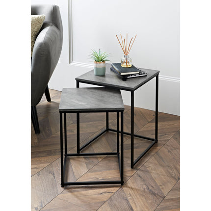 Stylish nesting tables featuring a gray stone